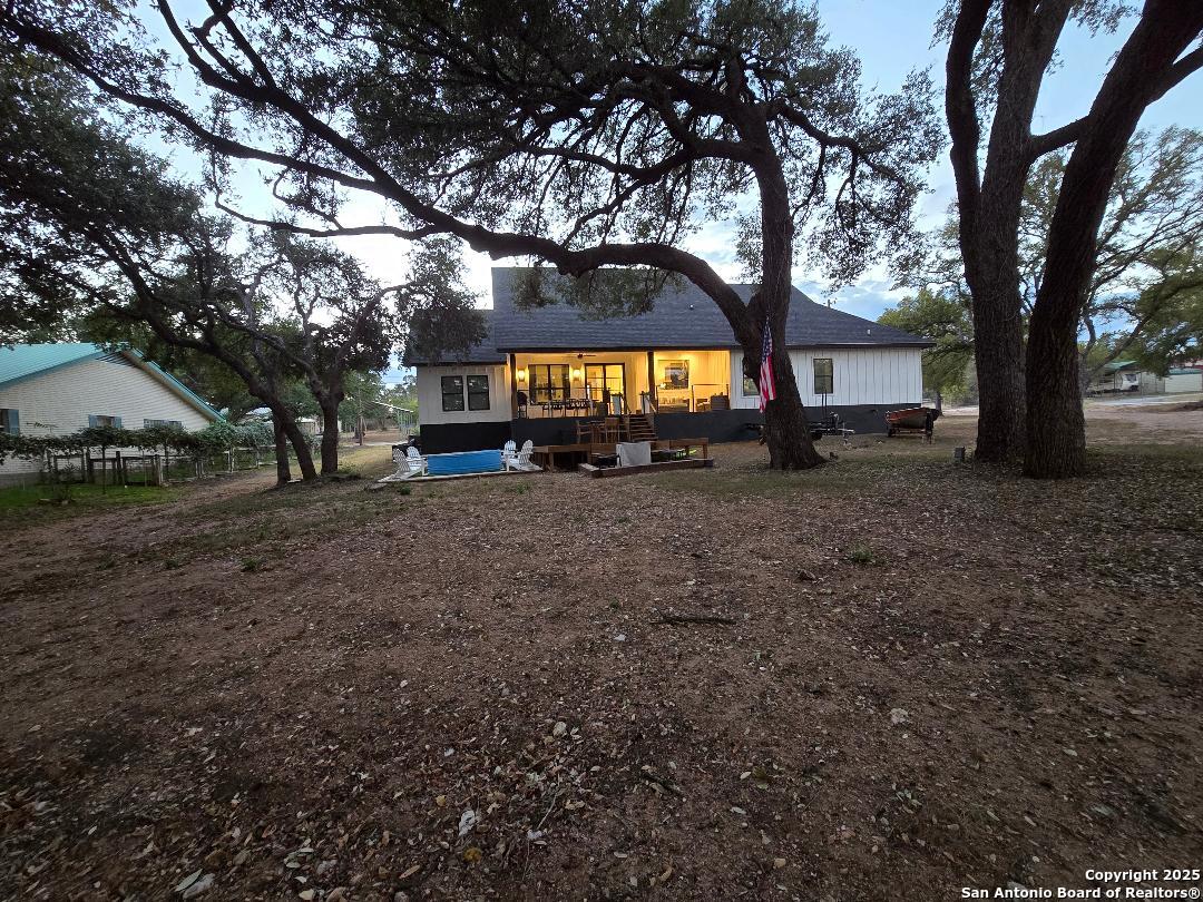 451 Legion Loop Kingsland, TX 78639 - Photo 18 of 23 a view of a house with a yard