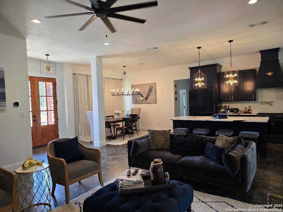 451 Legion Loop Kingsland, TX 78639 - Photo 2 of 23 a living room with furniture and a large window