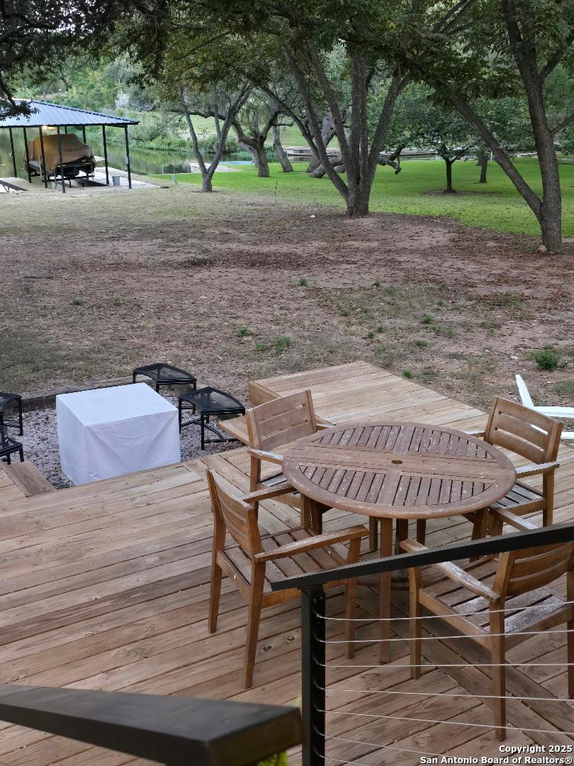 451 Legion Loop Kingsland, TX 78639 - Photo 21 of 23 a view of a backyard with furniture and a patio