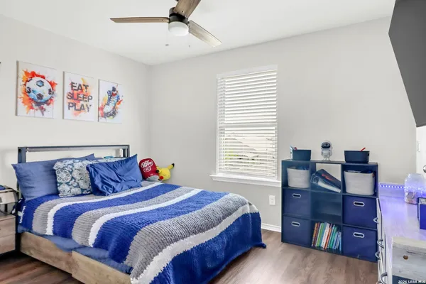 a bedroom with a bed and a bookshelf