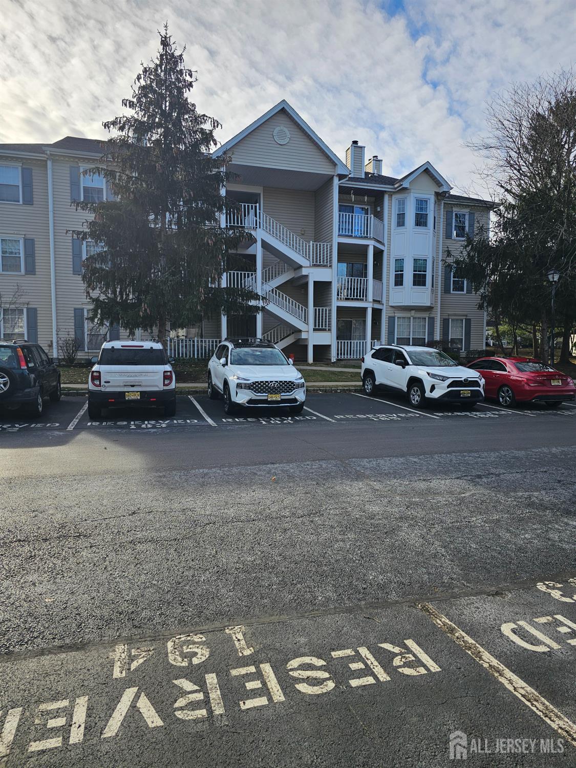 a view of street with parked cars