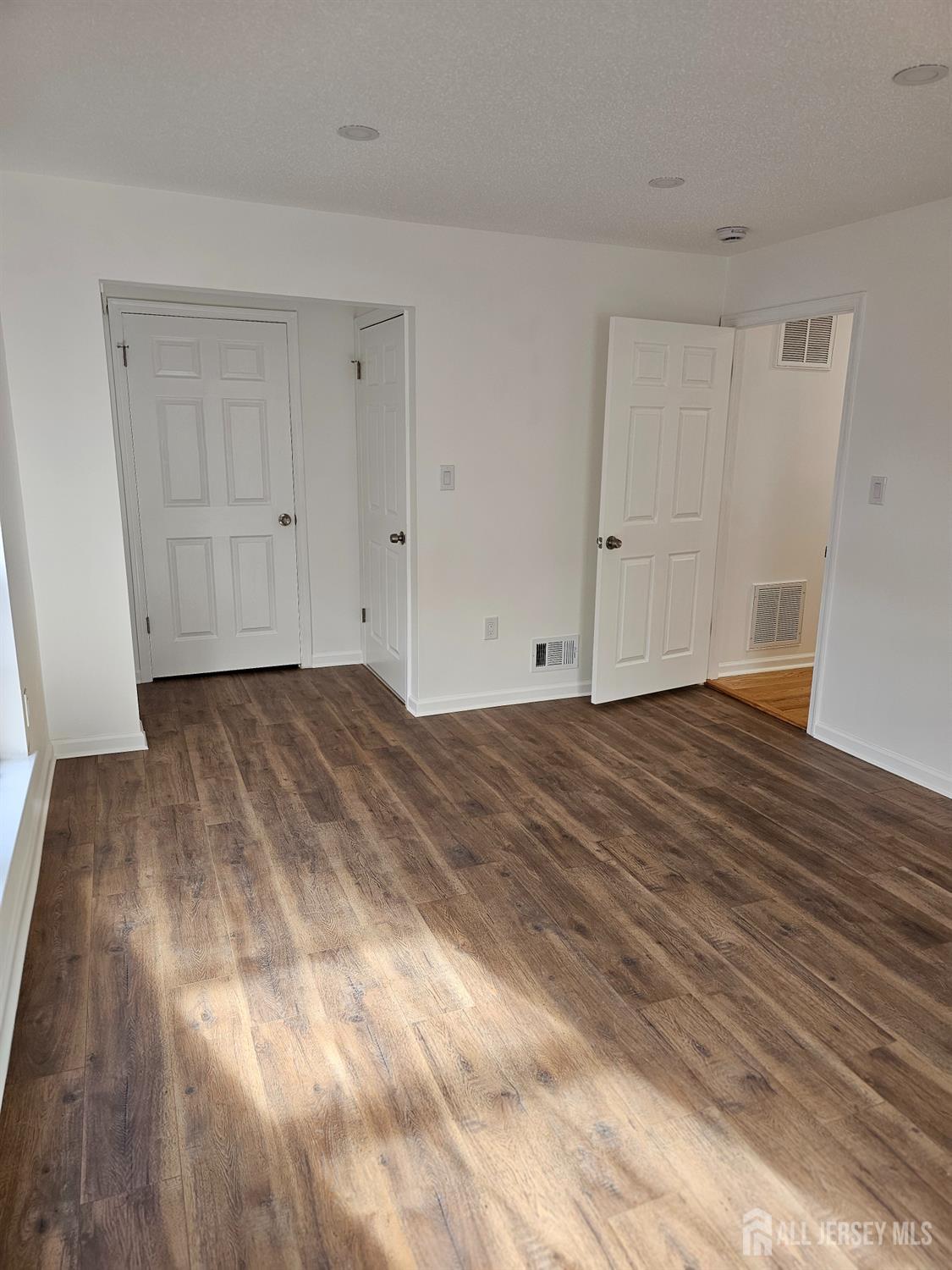 21 Brighton Way North Brunswick, NJ 08902 - Photo 14 of 20 a view of room with wooden floor