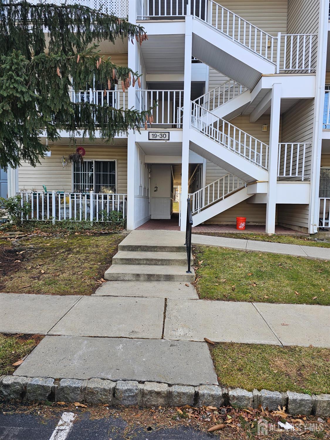 21 Brighton Way North Brunswick, NJ 08902 - Photo 2 of 20 a front view of a house with a yard