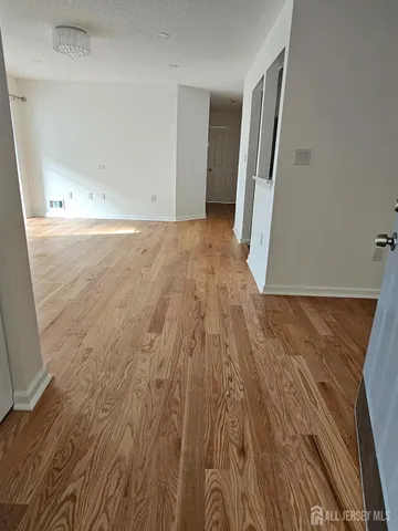 wooden floor in a hall with an entryway