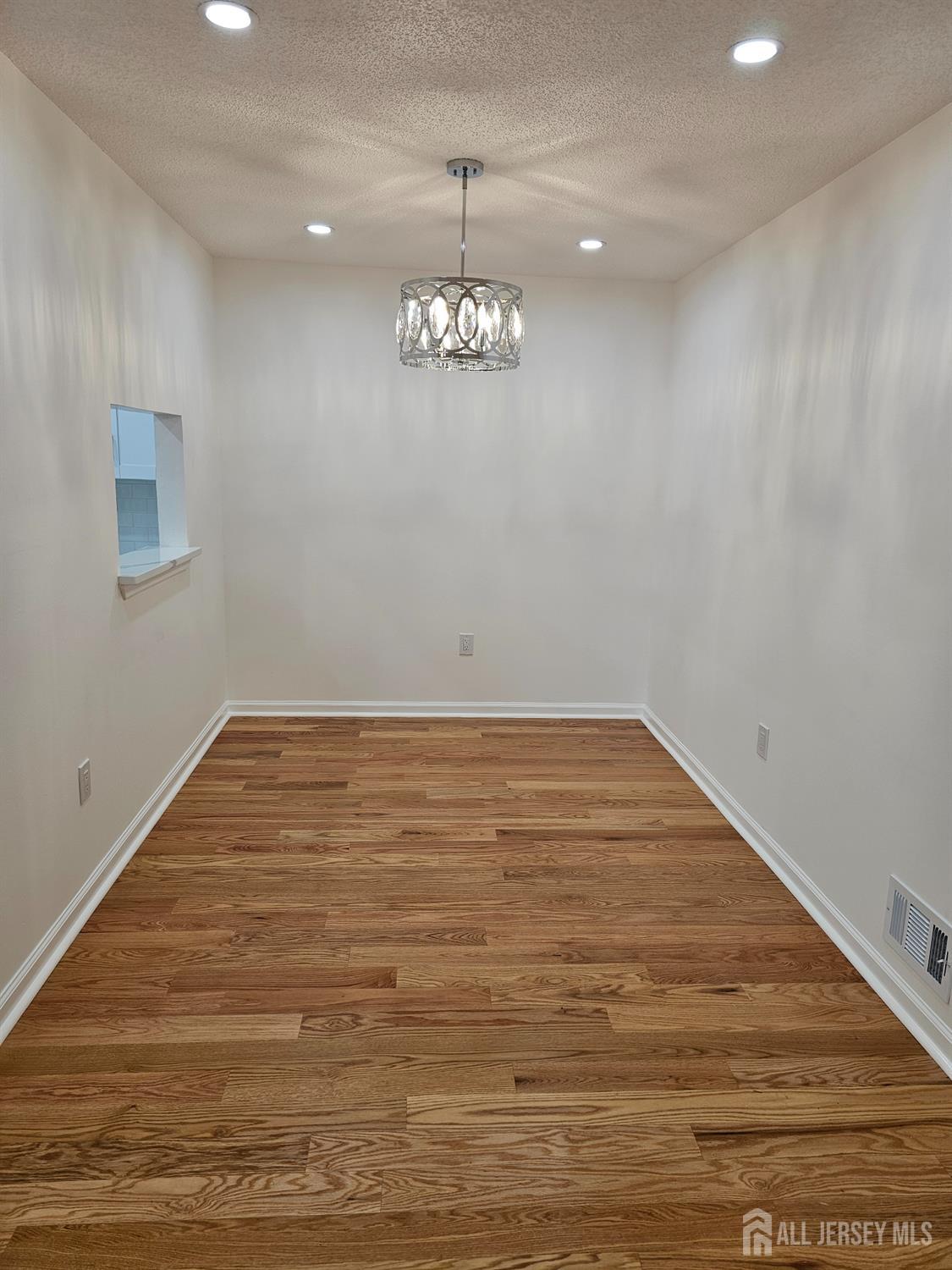 21 Brighton Way North Brunswick, NJ 08902 - Photo 4 of 20 a view of room with wooden floor