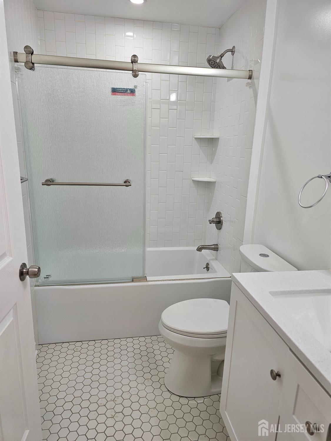 21 Brighton Way North Brunswick, NJ 08902 - Photo 10 of 20 a bathroom with a toilet and a shower