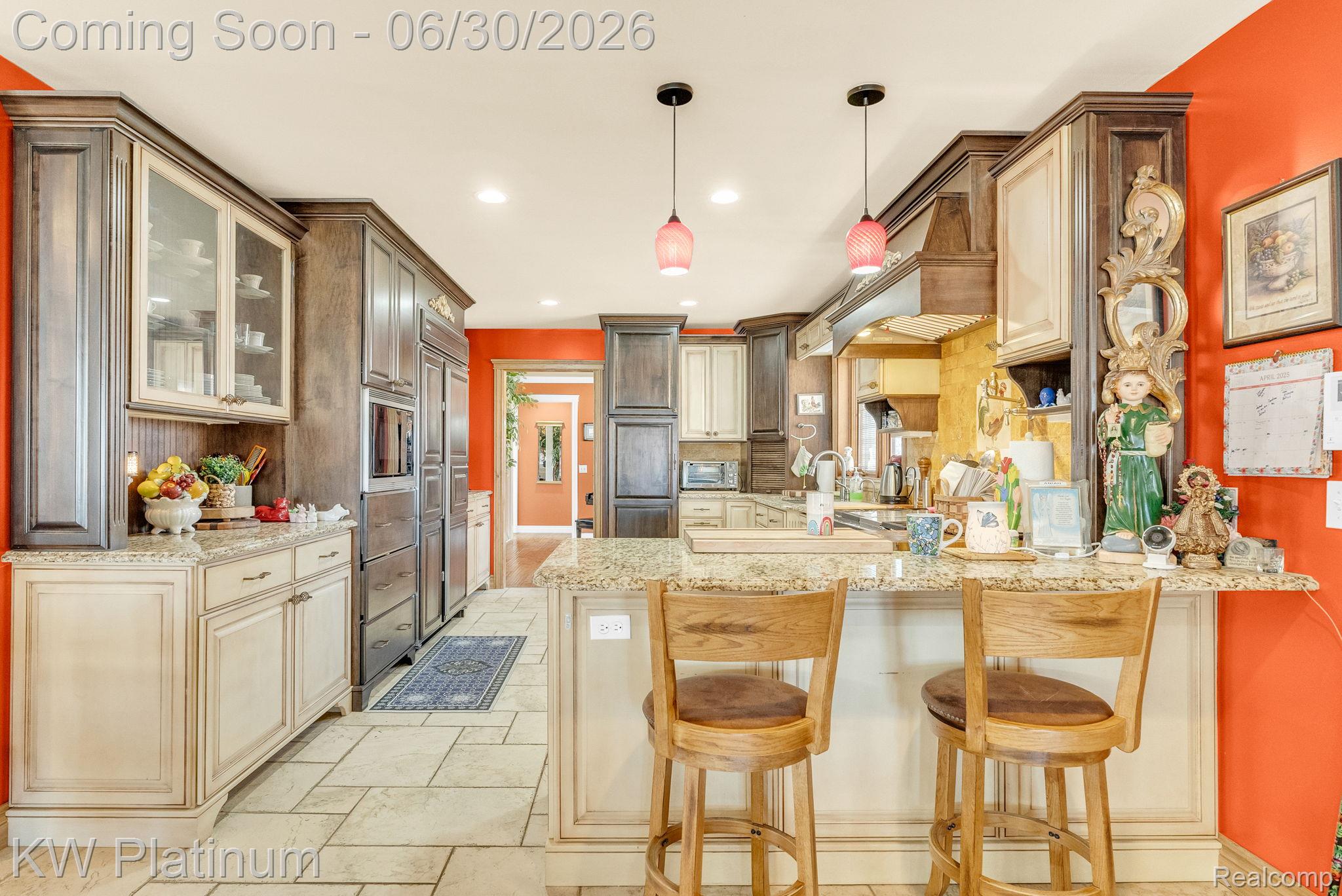 2235 South Lake Shore Road Harbor Beach, MI 48441 - Photo 10 of 99 Spacious kitchen featuring an expansive island with granite countertops, integrated appliances, recessed lighting, and tile flooring