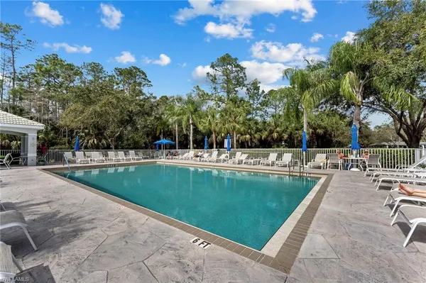 a view of a swimming pool with a patio