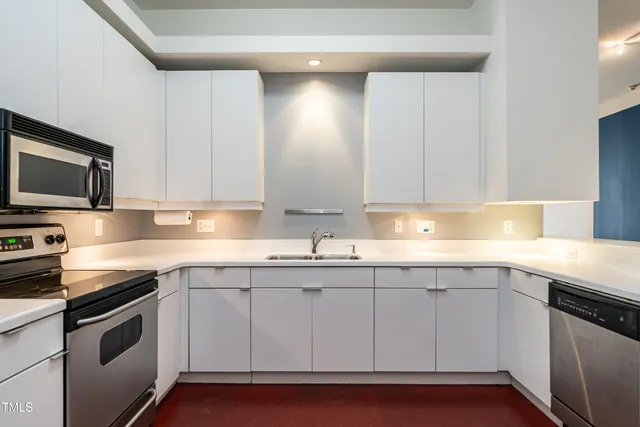 a kitchen with a sink and cabinets