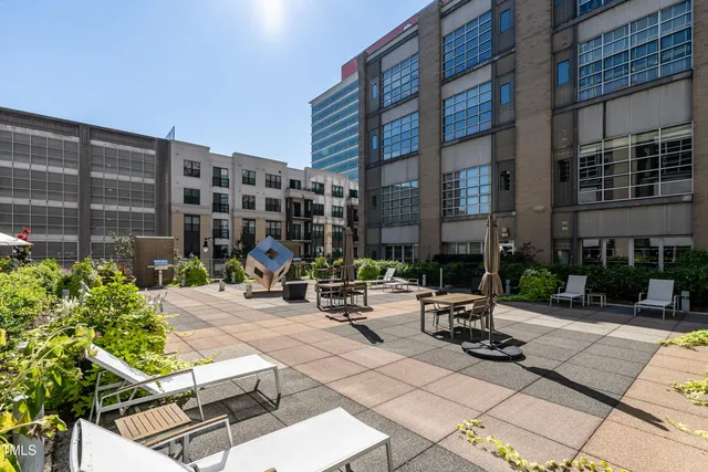 a front view of a building with garden