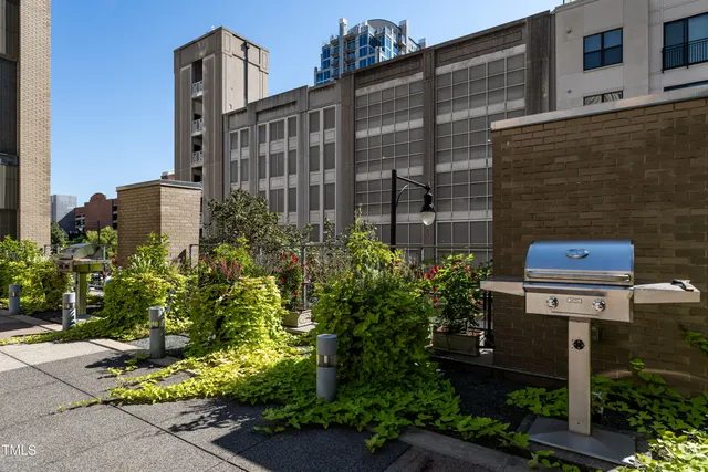 a view of parking garage with cars parked