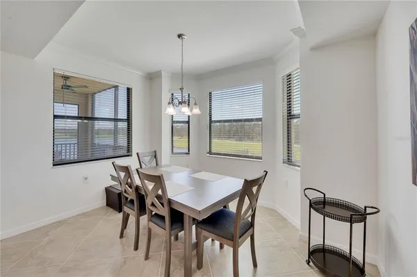 a dining room with furniture and window