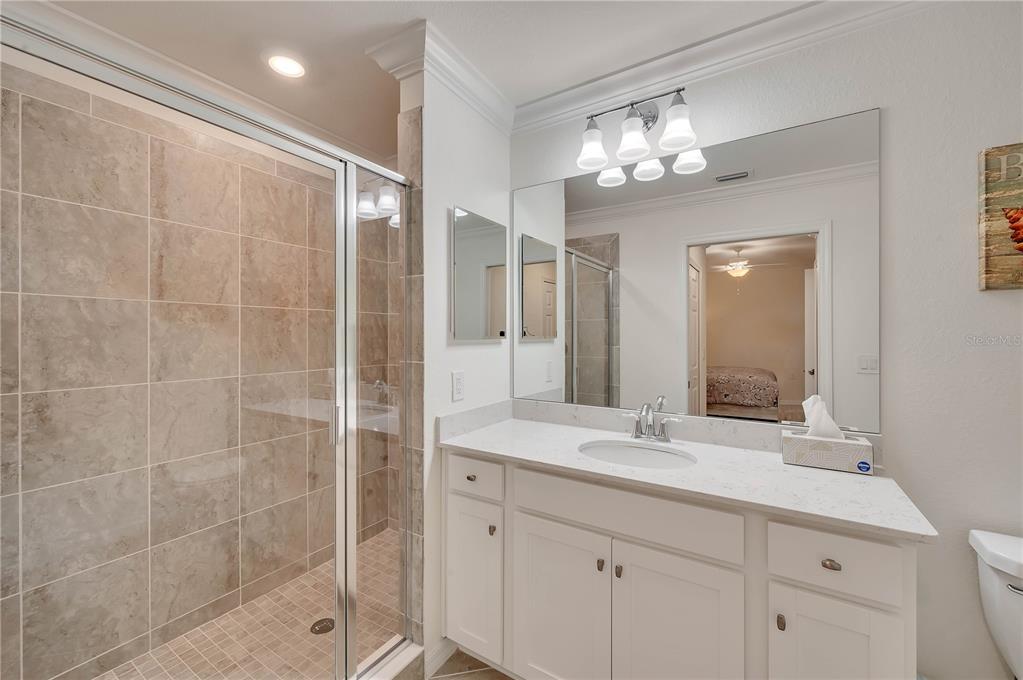17510 Gawthrop Drive, Unit 203 Lakewood Ranch, FL 34211 - Photo 19 of 54 a bathroom with a double vanity sink mirror and shower