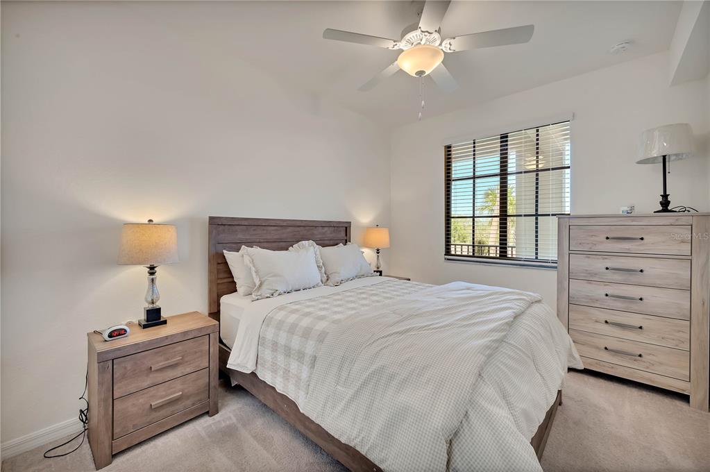 17510 Gawthrop Drive, Unit 203 Lakewood Ranch, FL 34211 - Photo 20 of 54 a bedroom with a bed and a window