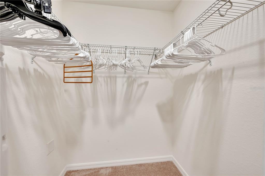 17510 Gawthrop Drive, Unit 203 Lakewood Ranch, FL 34211 - Photo 23 of 54 a view of a room with racks on the wall