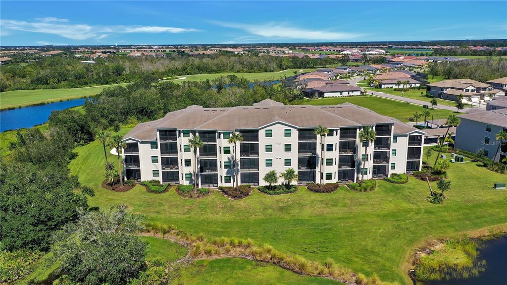 17510 Gawthrop Drive, Unit 203 Lakewood Ranch, FL 34211 - Photo 28 of 54 an aerial view of a house with a garden