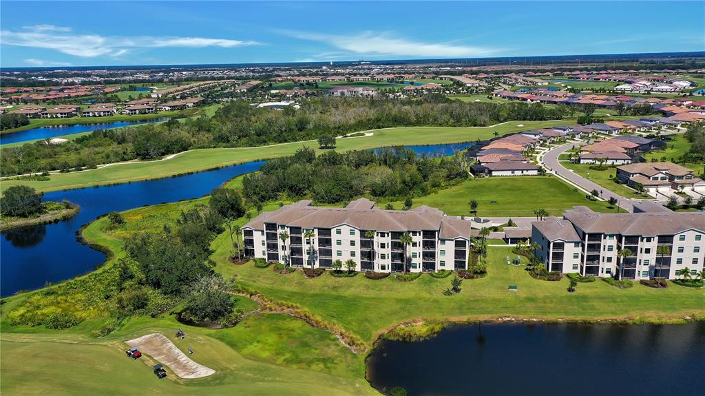 17510 Gawthrop Drive, Unit 203 Lakewood Ranch, FL 34211 - Photo 29 of 54 an aerial view of a house with garden space ocean view