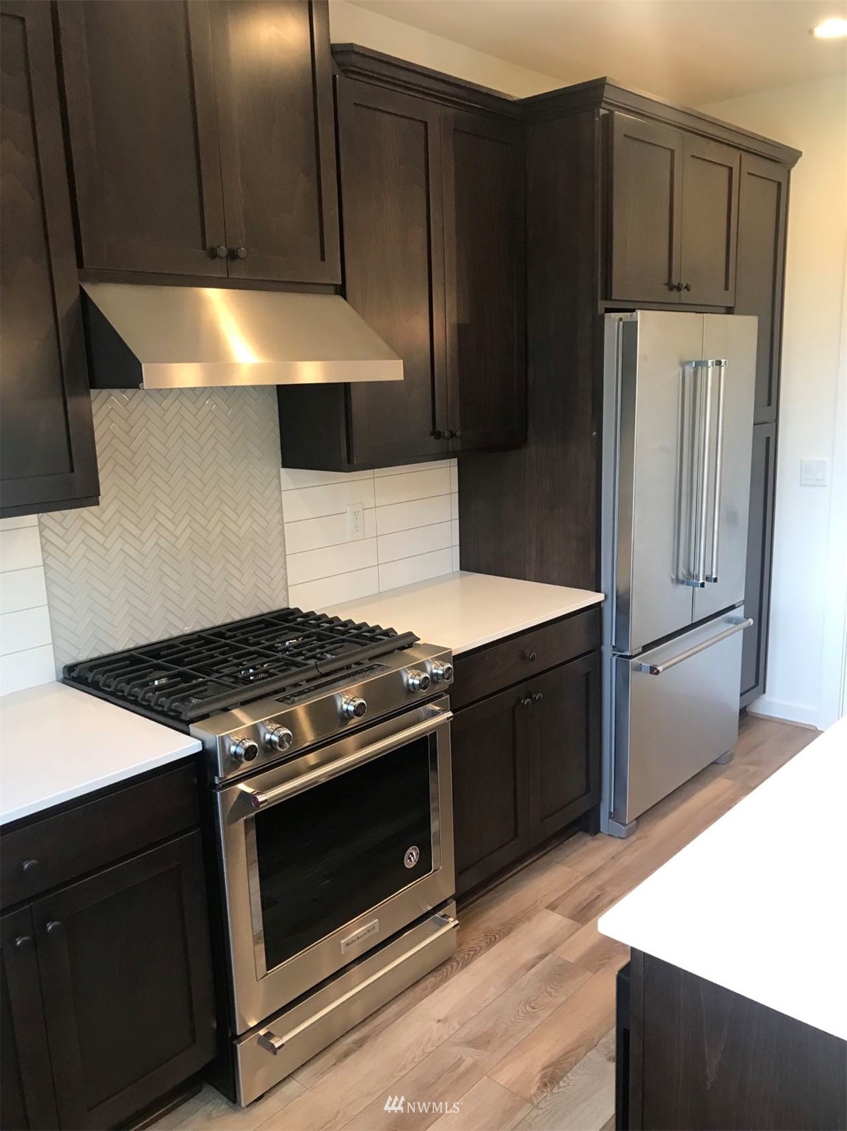 2405 217th Street Southeast, Unit B Bothell, WA 98021 - Photo 15 of 27 a kitchen with a stove and a refrigerator
