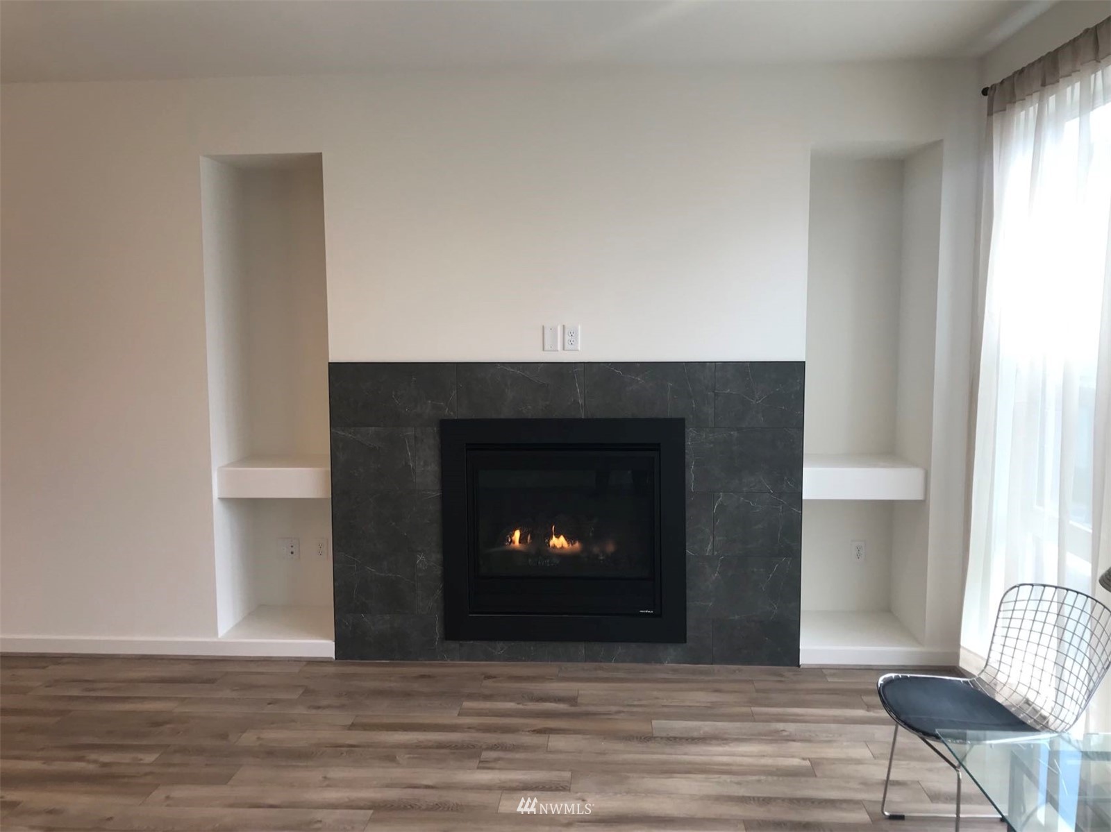 2405 217th Street Southeast, Unit B Bothell, WA 98021 - Photo 18 of 27 a living room with a fireplace and a fireplace