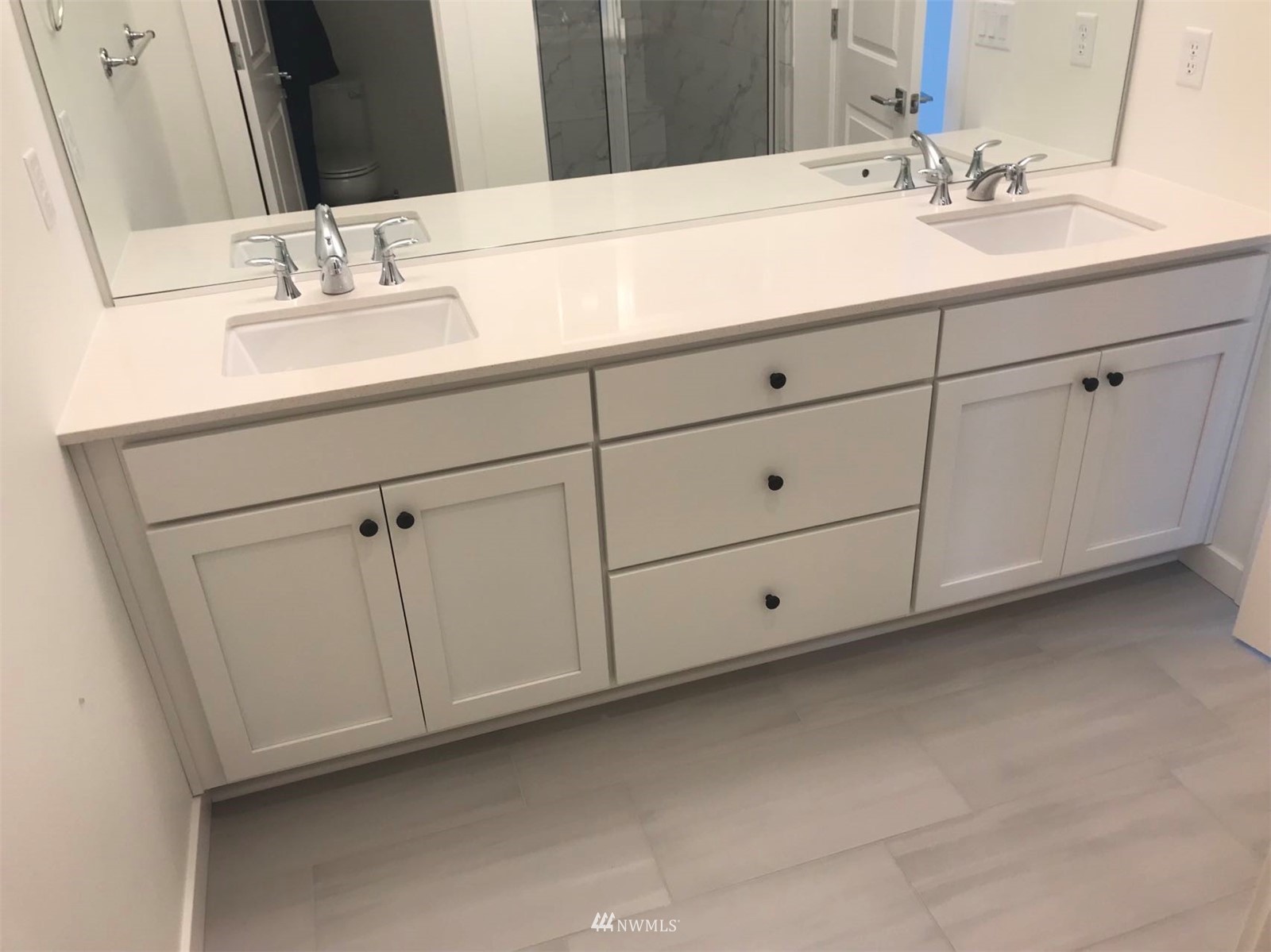 2405 217th Street Southeast, Unit B Bothell, WA 98021 - Photo 27 of 27 a bathroom with a sink and a mirror
