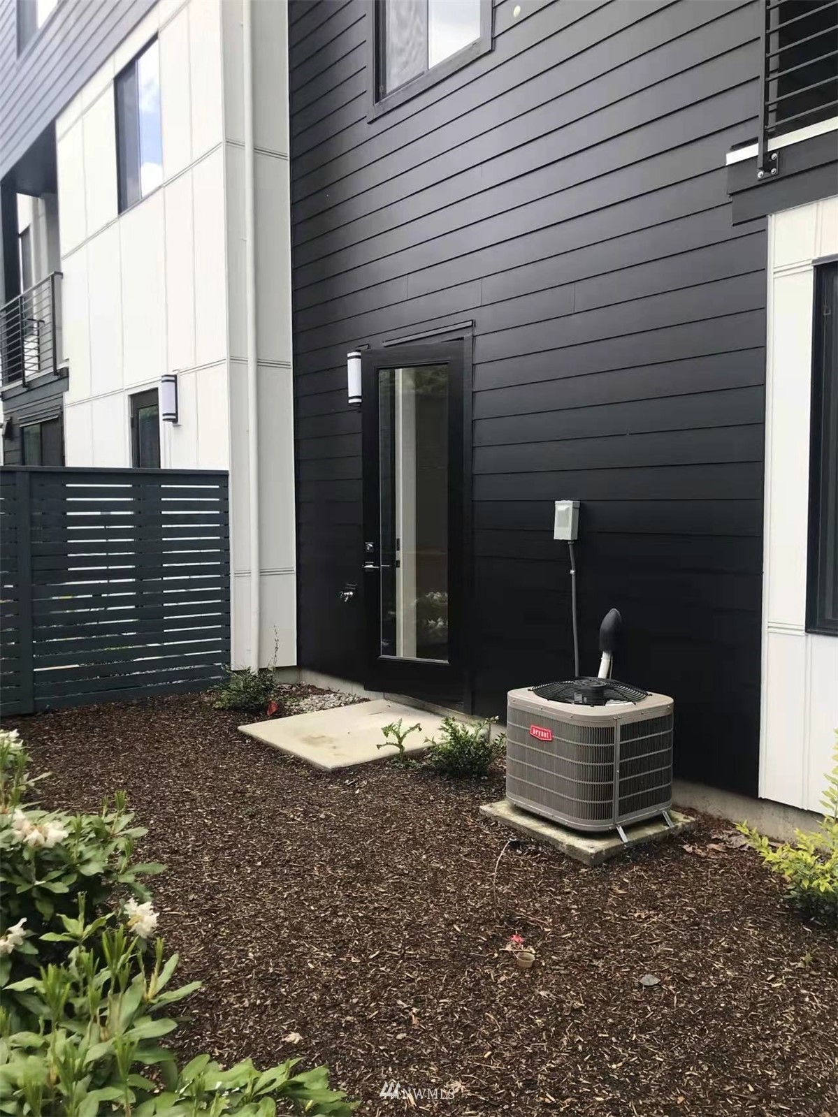 2405 217th Street Southeast, Unit B Bothell, WA 98021 - Photo 5 of 27 a front view of a house with a yard