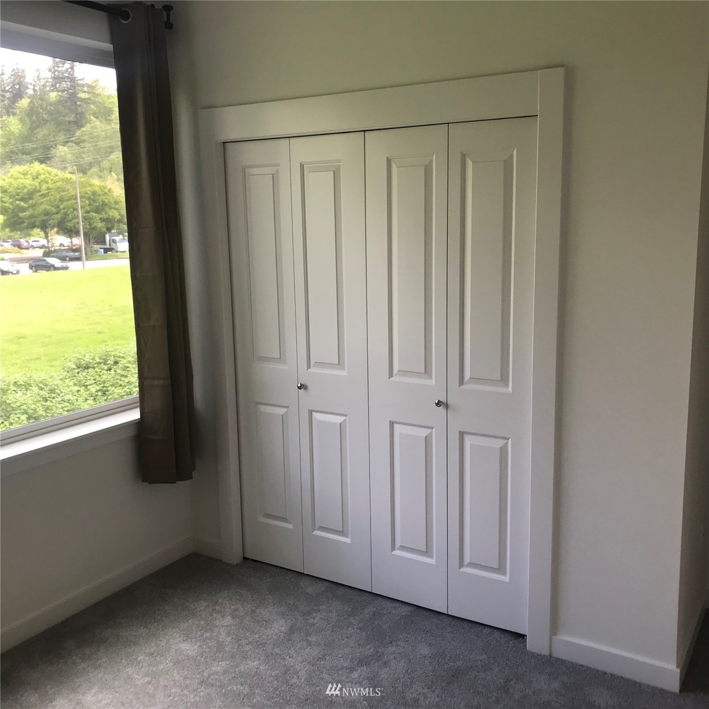 2405 217th Street Southeast, Unit B Bothell, WA 98021 - Photo 7 of 27 a view of an empty room and window