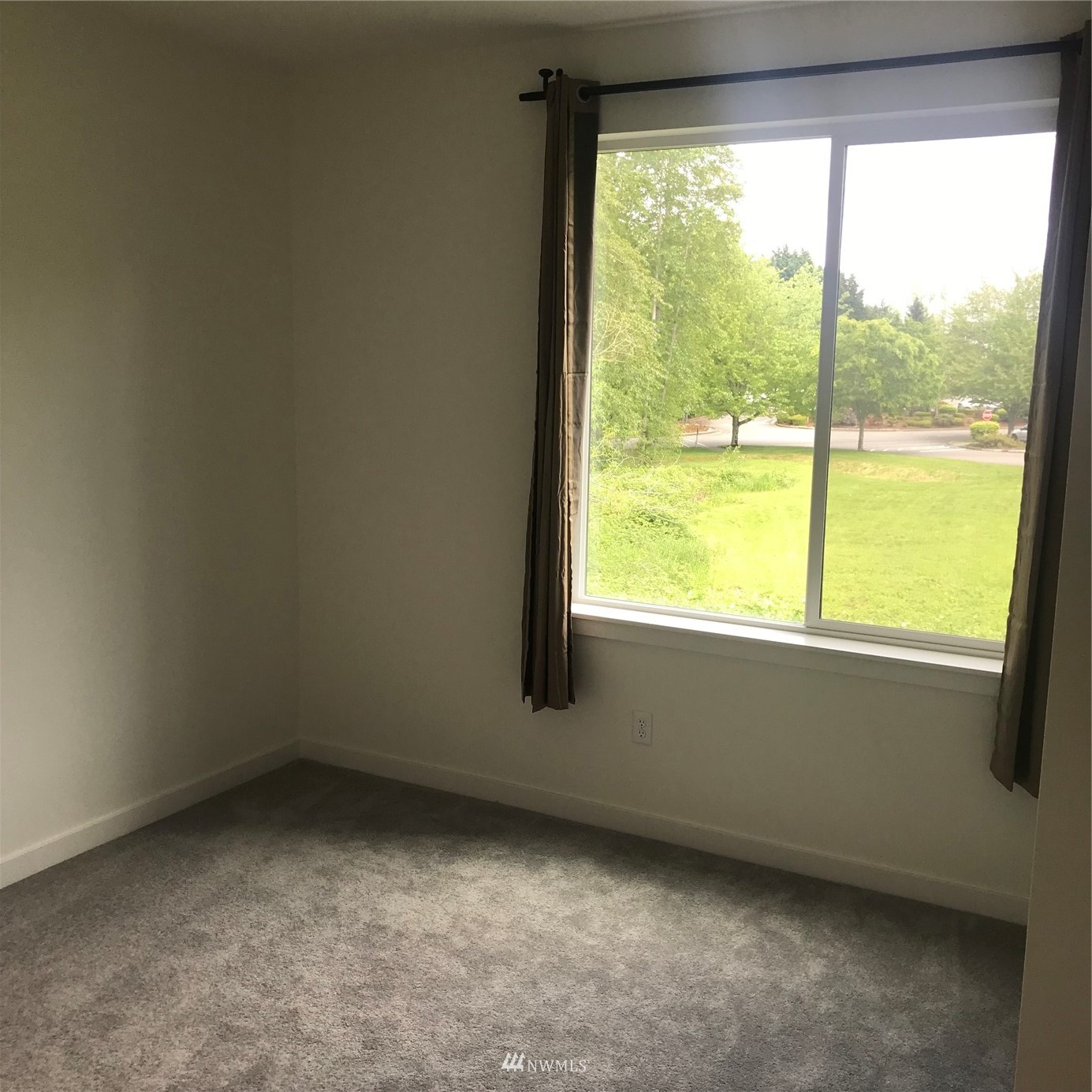 2405 217th Street Southeast, Unit B Bothell, WA 98021 - Photo 8 of 27 an empty room with a window