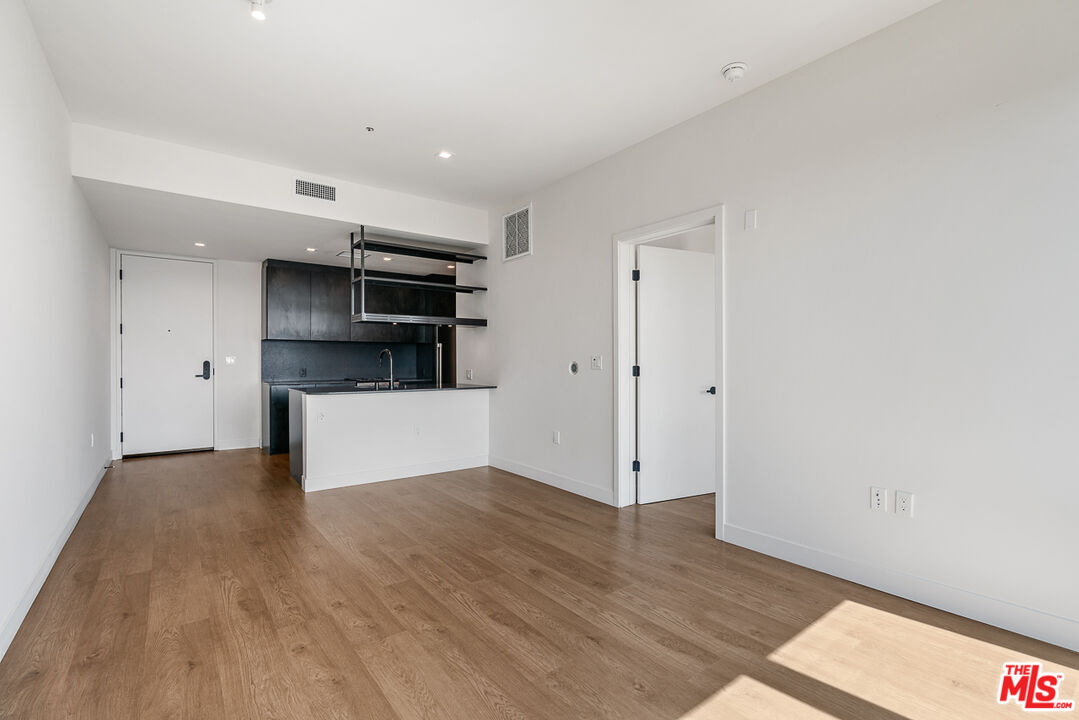 10700 Tabor Street, Unit 524 Los Angeles, CA 90034 - Photo 6 of 12 a view of a kitchen with a sink and a refrigerator