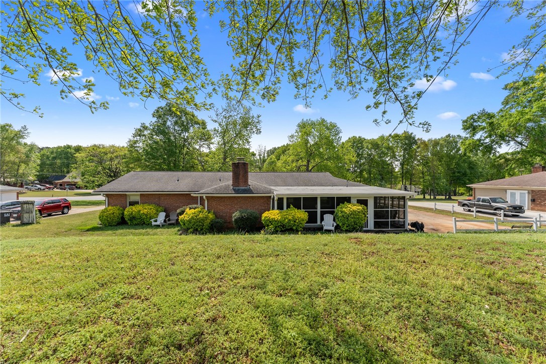 1007 Brown Road Anderson, SC 29621 - Photo 27 of 27 This ranch-style home features a spacious yard and a charming screened-in porch.