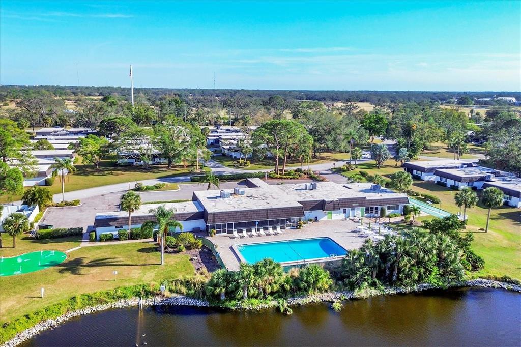 3990 Overlook Bend Terrace, Unit 19 Sarasota, FL 34232 - Photo 26 of 29 an aerial view of residential houses with outdoor space and lake view