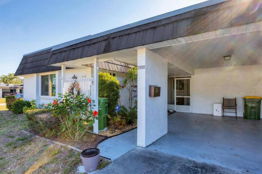 3990 Overlook Bend Terrace, Unit 19 Sarasota, FL 34232 - Photo 3 of 29 front view of a house with a porch