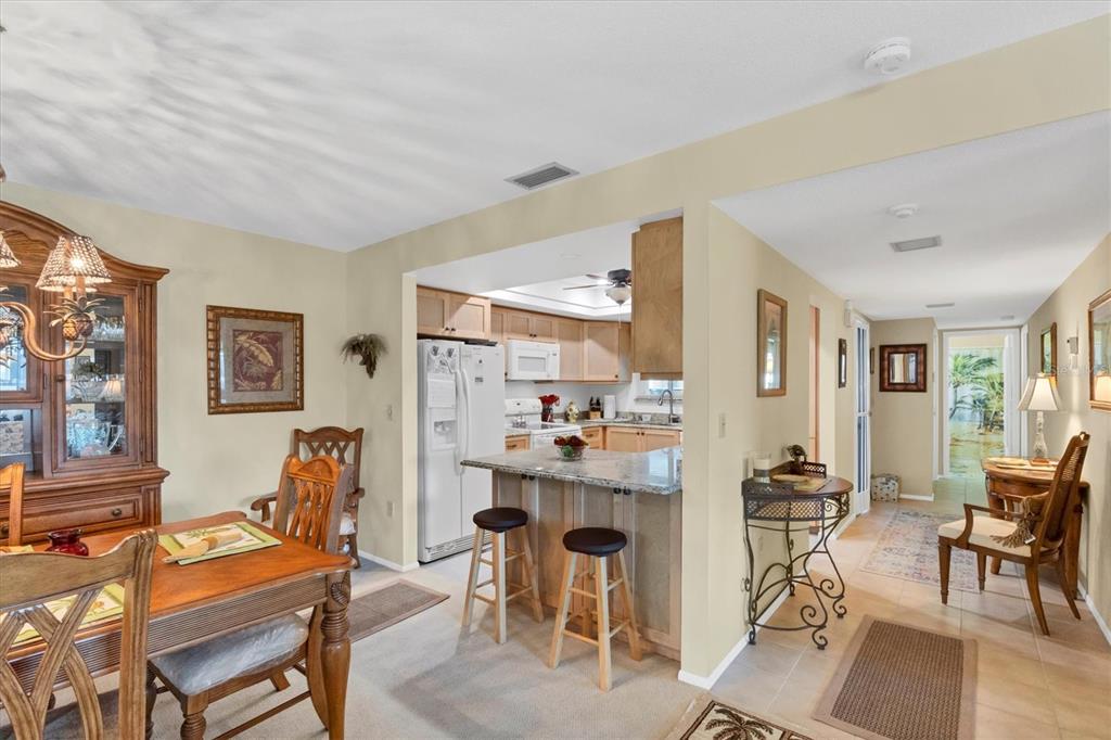 3990 Overlook Bend Terrace, Unit 19 Sarasota, FL 34232 - Photo 10 of 29 a living room with furniture and wooden floor