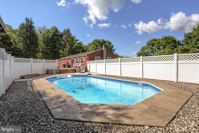 a view of a swimming pool with a patio