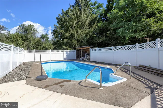 a view of a swimming pool with a patio
