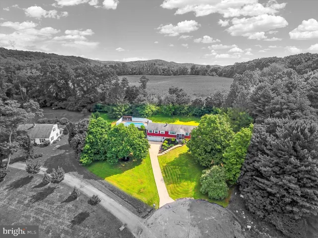 a view of a swimming pool with a yard