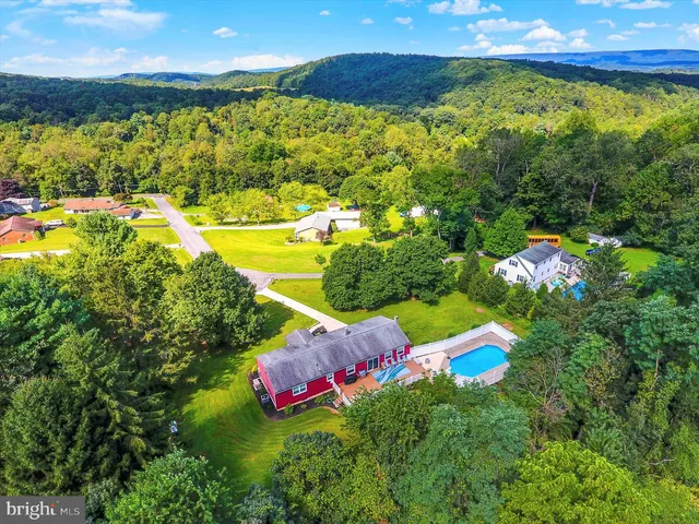 a picture of a bathroom with a white wall