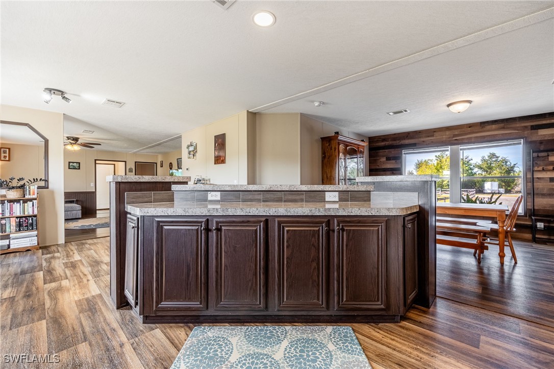 10491 Deal Road North Fort Myers, FL 33917 - Photo 15 of 48 a kitchen with stainless steel appliances granite countertop a stove and a refrigerator
