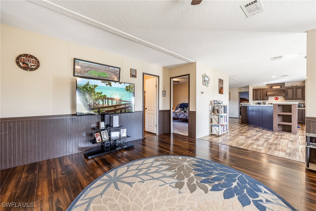 10491 Deal Road North Fort Myers, FL 33917 - Photo 20 of 48 a living room with furniture and a wooden floor
