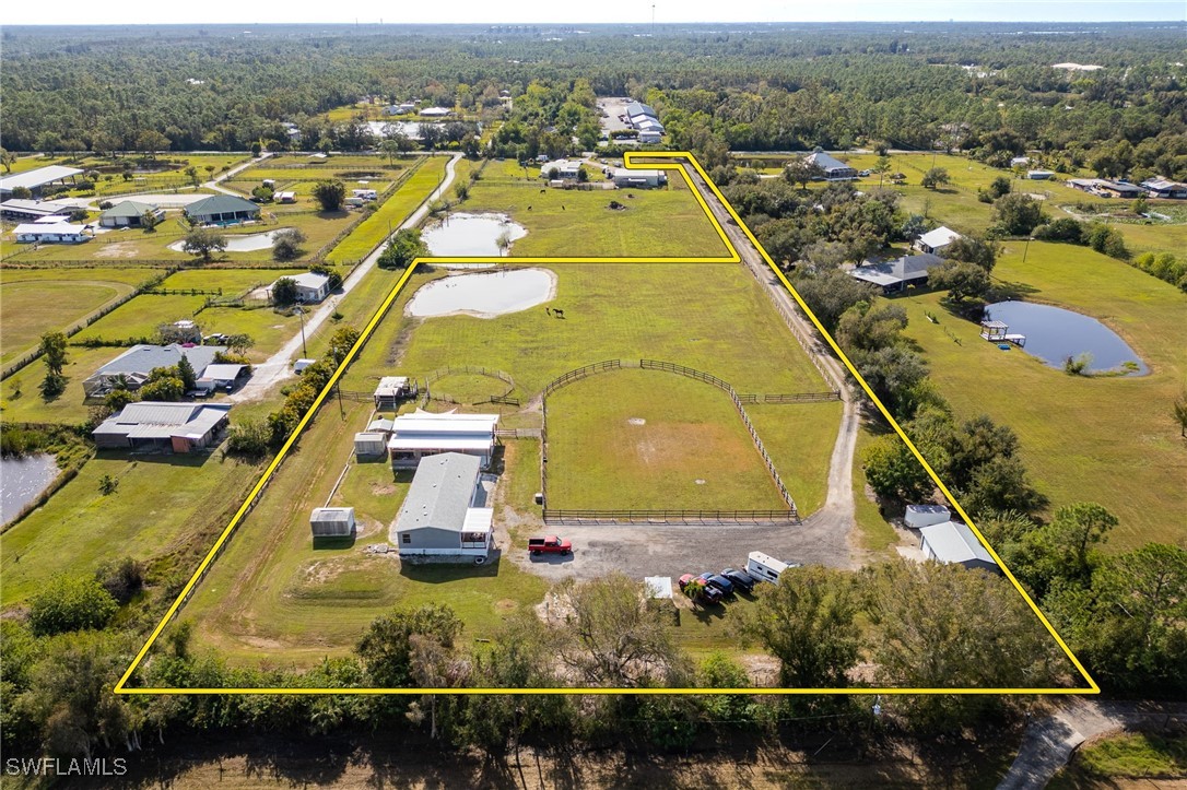 10491 Deal Road North Fort Myers, FL 33917 - Photo 41 of 48 an aerial view of a residential houses with outdoor space