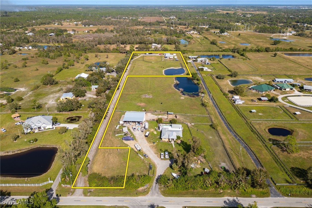 10491 Deal Road North Fort Myers, FL 33917 - Photo 47 of 48 an aerial view of residential houses with outdoor space