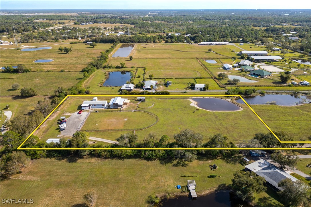 10491 Deal Road North Fort Myers, FL 33917 - Photo 48 of 48 an aerial view of residential houses with outdoor space