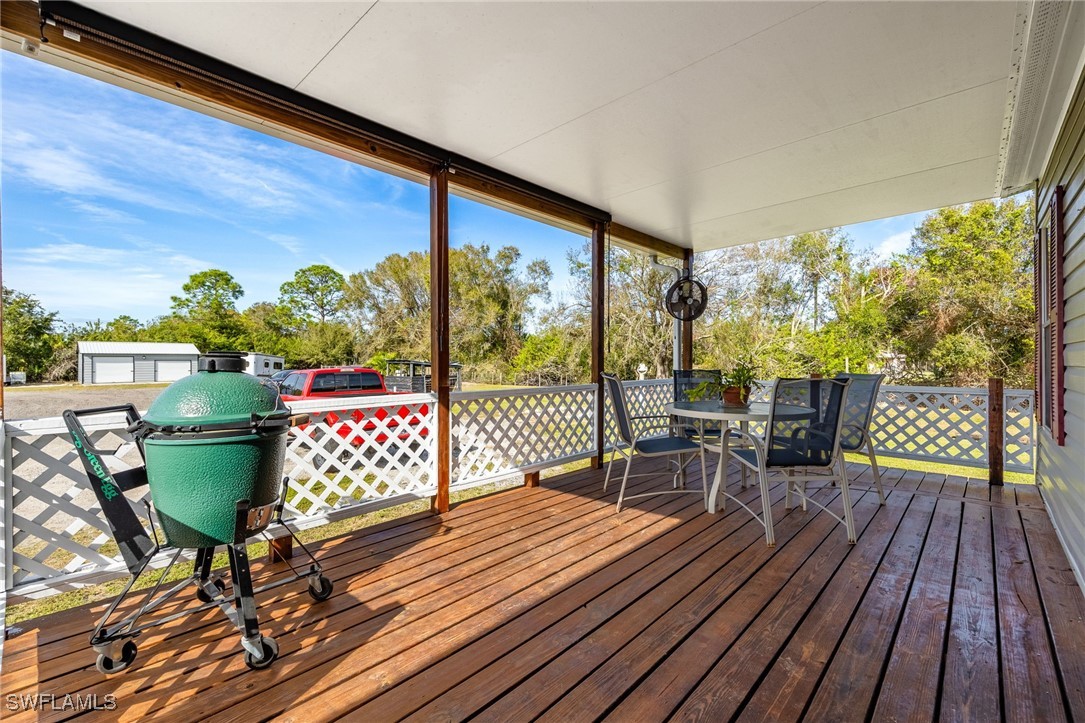 10491 Deal Road North Fort Myers, FL 33917 - Photo 6 of 48 a outdoor view with a sitting space and large windows