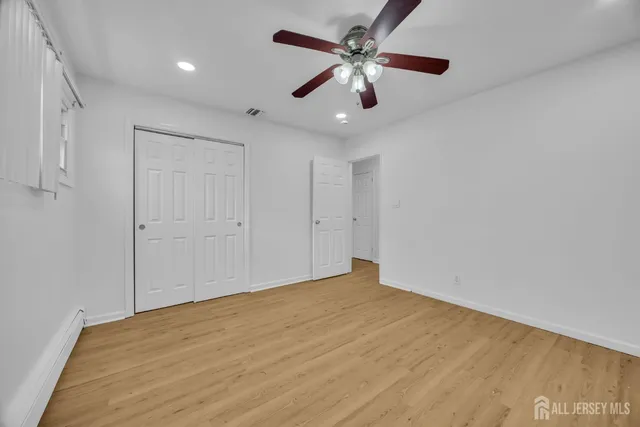 an empty room with fan