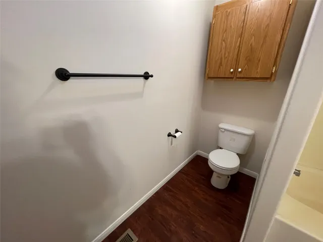 a bathroom with a toilet and a sink