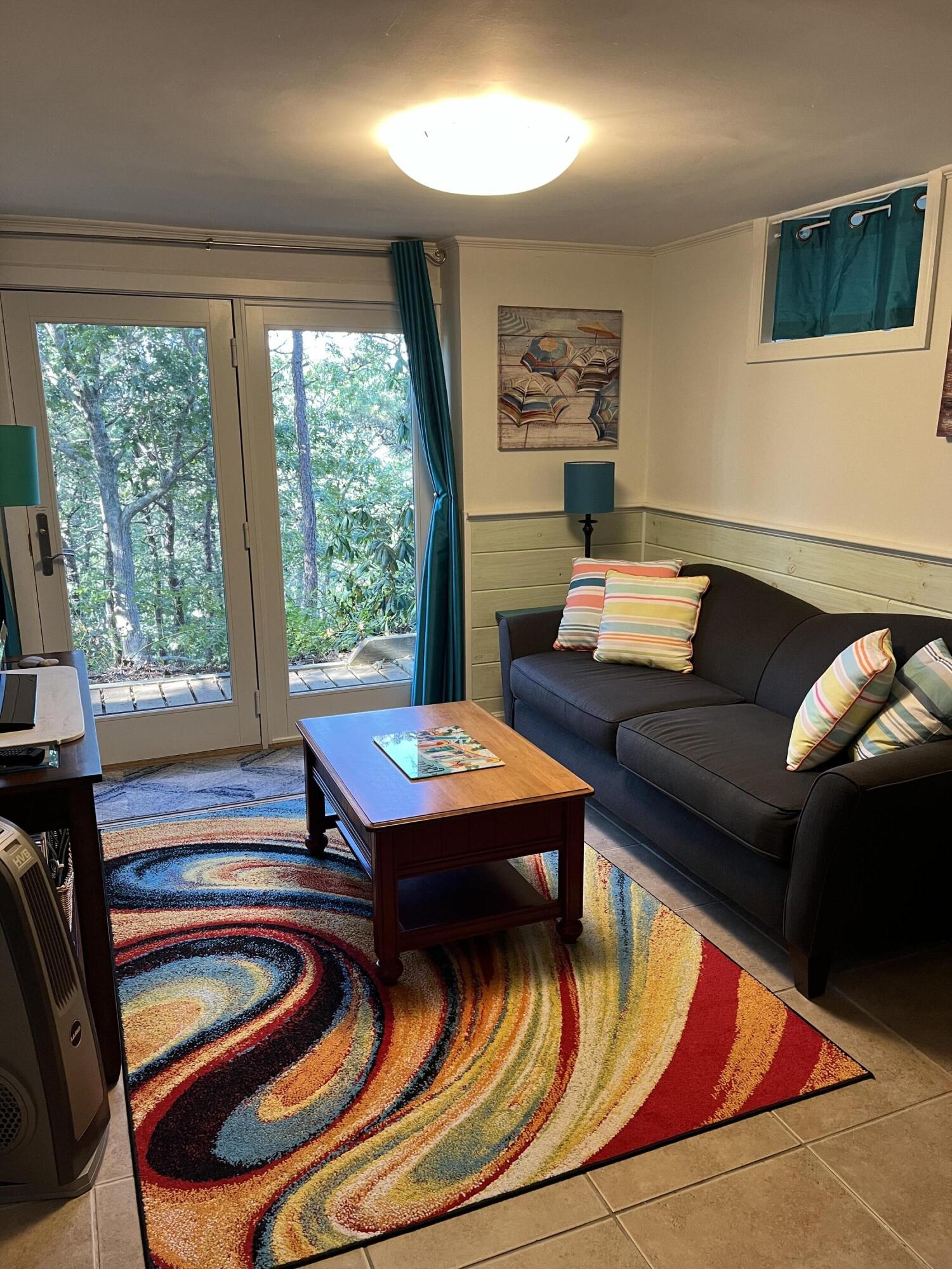 9 Kinnikinnick Road Truro, MA 02666 - Photo 21 of 38 SITTING AREA IN LOWER AREA OF MAIN HOUSE