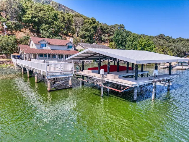 a view of a house with a bed deck and a garden