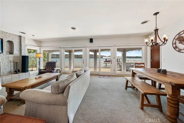 a kitchen with stainless steel appliances granite countertop a sink a stove and a wooden cabinets