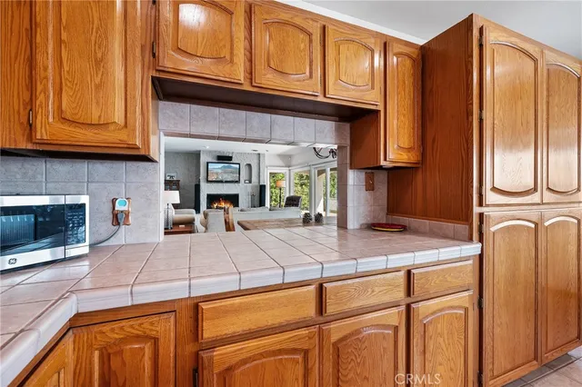 a bathroom with a toilet a sink a vanity and mirror