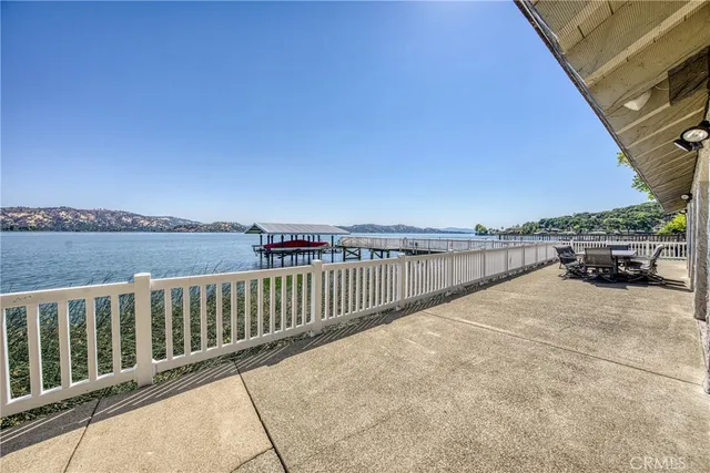 an aerial view of a house with swimming pool garden and patio