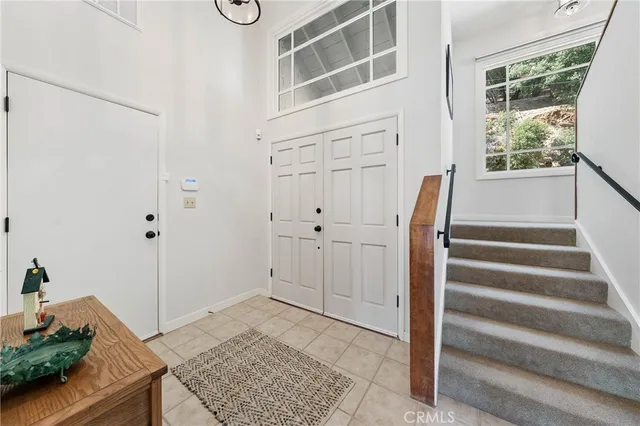 a view of entryway with wooden floor and cabinet